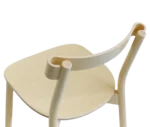 Closed-up of Bla Station Still Life chair, in natural timber with a curved backrest.