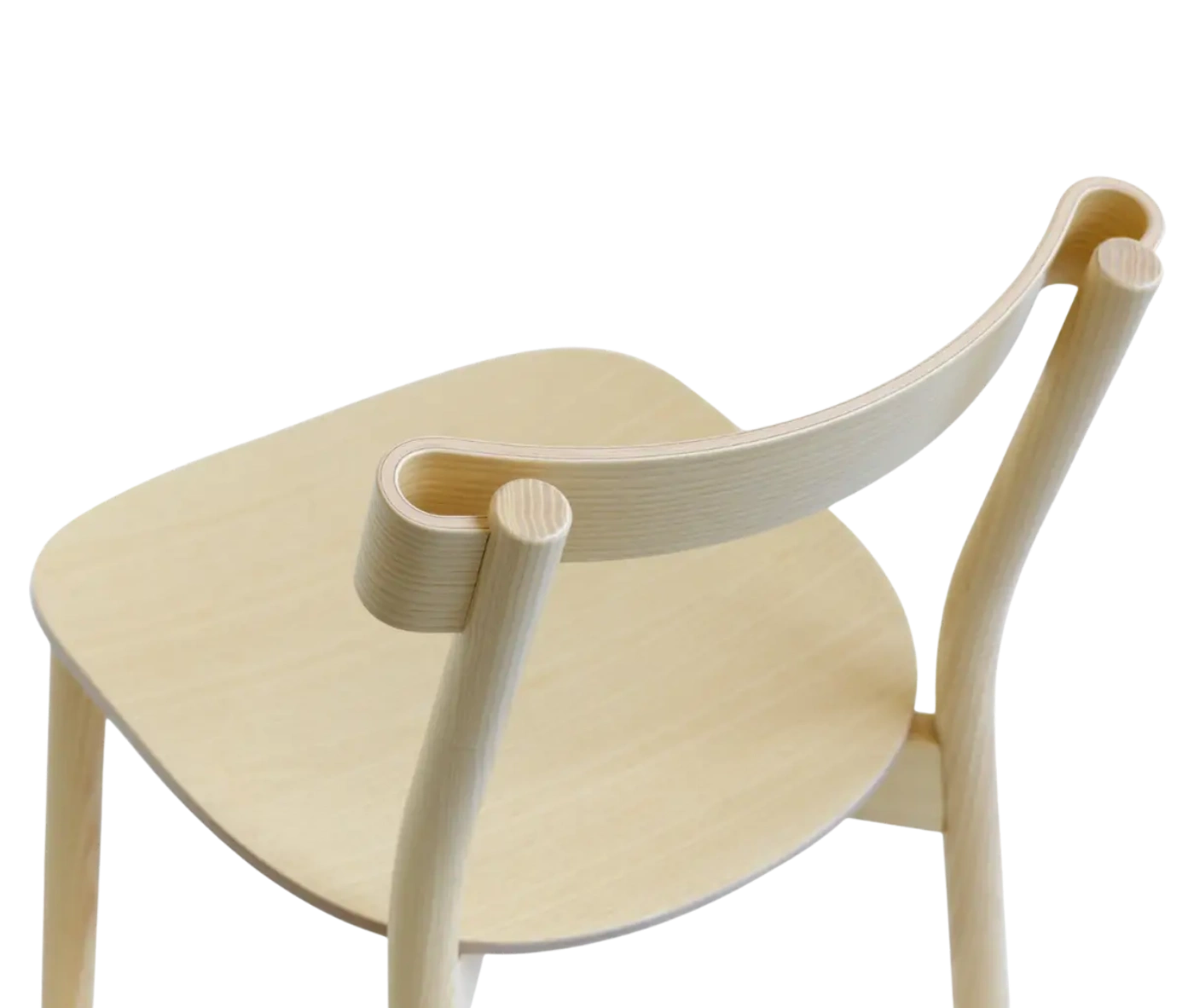 Closed-up of Bla Station Still Life chair, in natural timber with a curved backrest.
