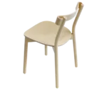 Bla Station Still Life chair, elevated view in natural timber with curved backrest and tapered legs.