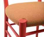 Closed-up view of Cizeta Alpha 2521 in red timber frame and elastic webbing upholstered seat.