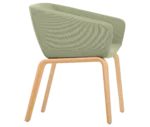 True Arca chair, right-side view with a light green fully upholstered wraparound shell and natural timber legs.