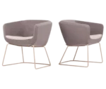 True Arca chairs with dark beige fully upholstered shell, white seat pad, and metal sled base.