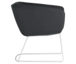 True Arca chair in right-side view with dark fully upholstered shell and metal sled base.