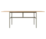 Blade table, front view with a long natural timber tabletop and dark metal frame.