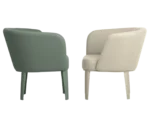 True Clara lounge chairs, facing each other with white and sage green upholstery, curved wraparound backrest, and slim legs.