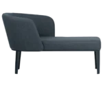 True Clara in right-side view, dark upholstery, wraparound backrest, and slim legs.