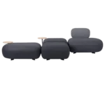 True Code modular seating with a rounded upholstered seat and integrated table on a curved frame.