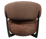 True Code lounge chair, back view with textured rust upholstery, a rounded seat and curved patterned backrest.