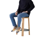 True Cute stool shown in use with a person seated.