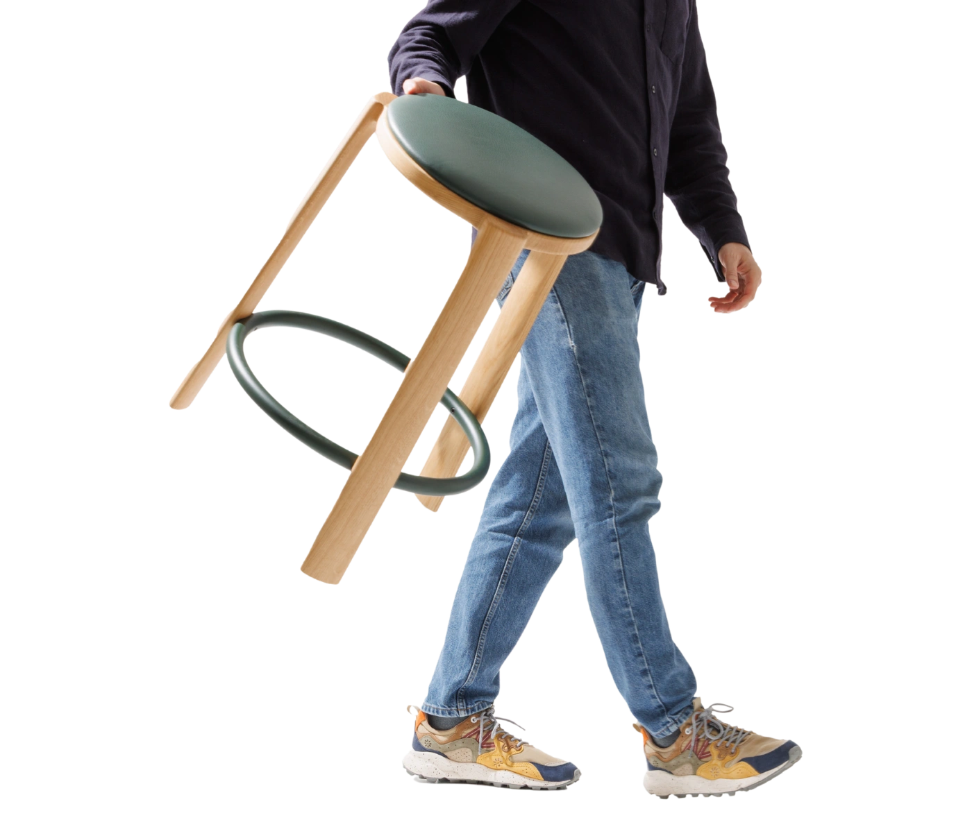 True Cute stool shown being carried by a person, highlighting its lightweight design and timber frame.