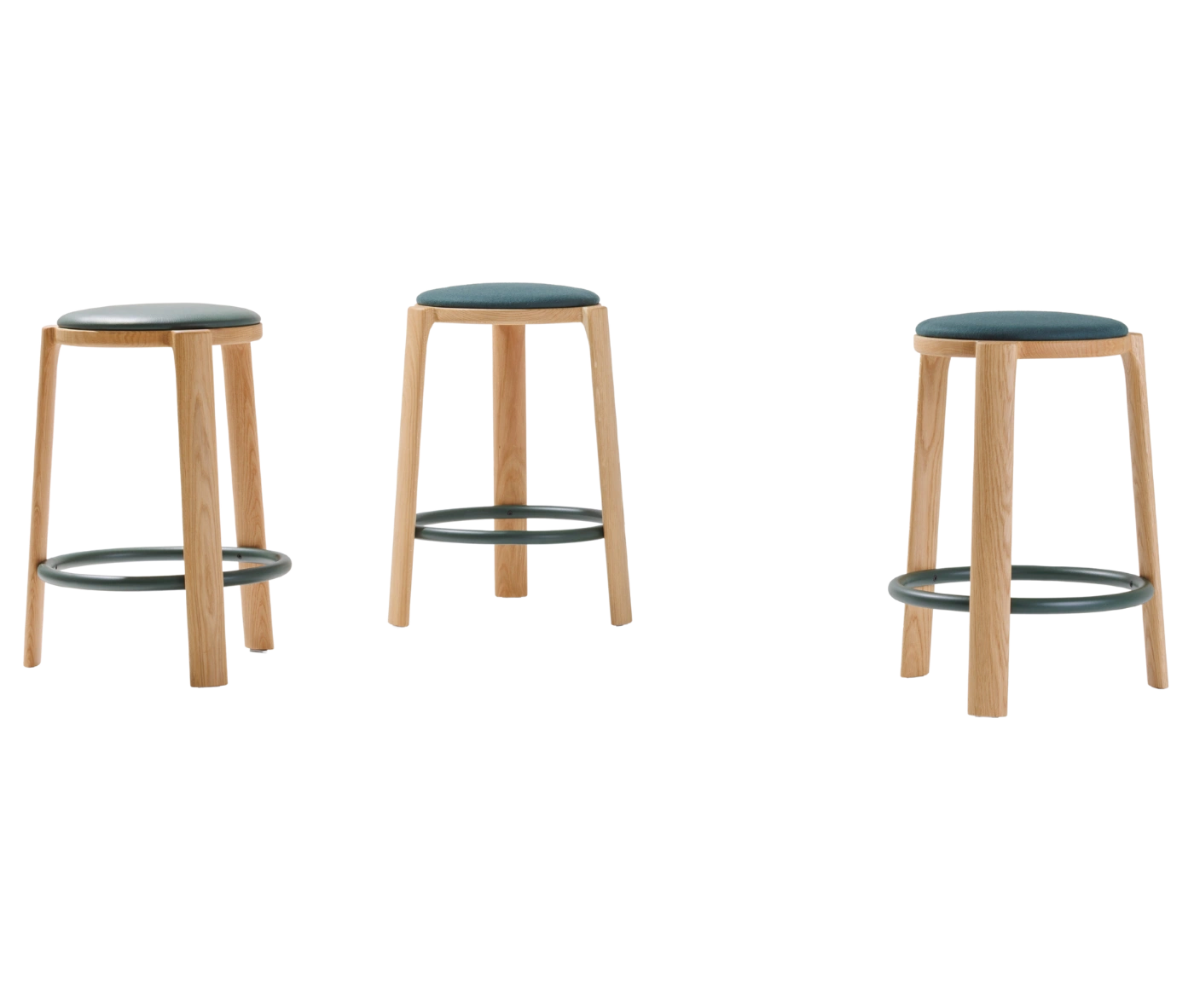 True Cute stools with upholstered seats, timber legs and circular footrests.