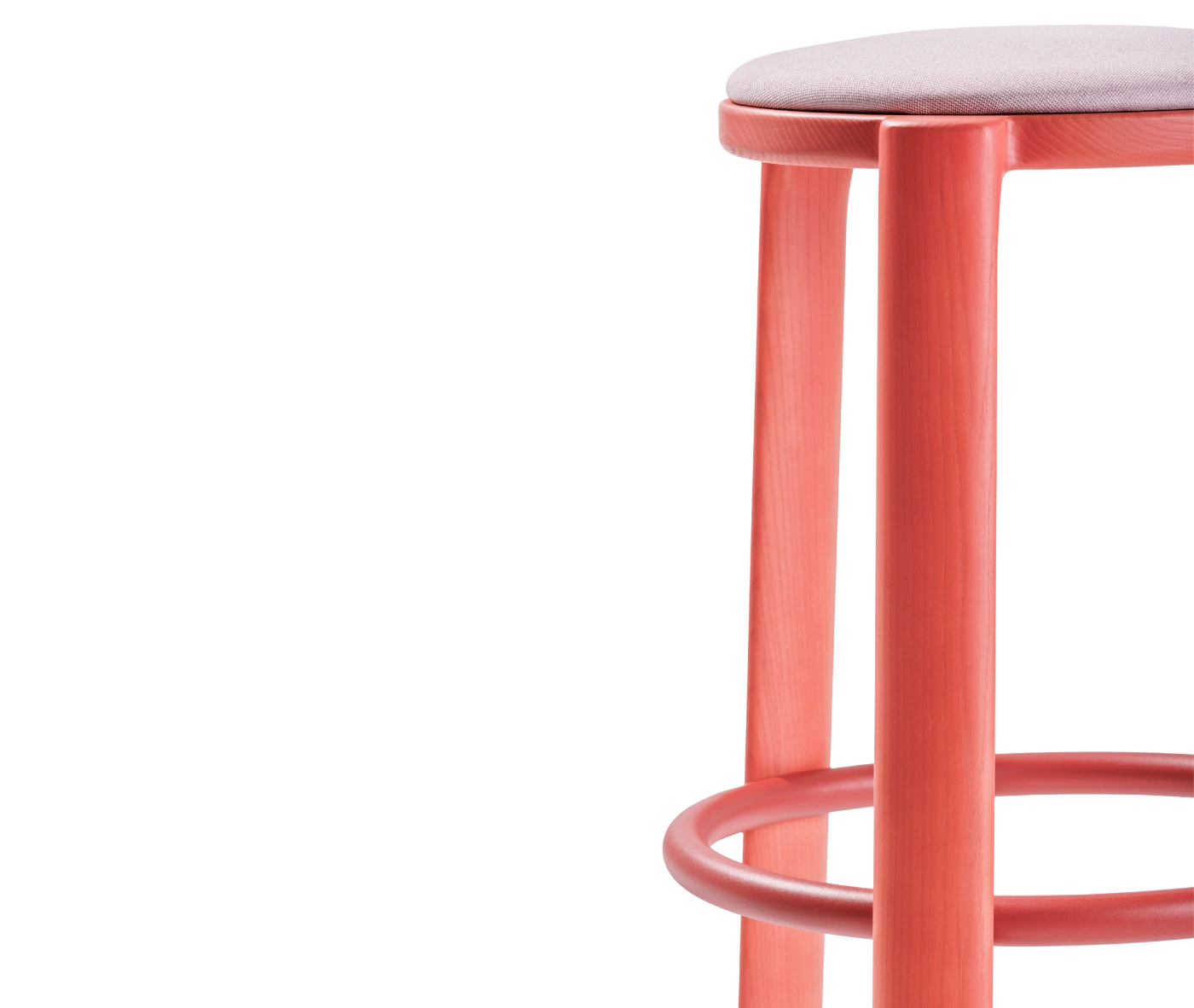 Half close-up view of True Cute stool with a light pink upholstered seat, long red timber legs and a circular footrest.