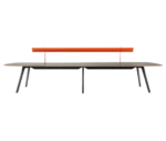 True Wing table in front view with dark timber top and frame, featuring an integrated brass reading lamp in orange finish.
