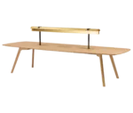 True Wing Library table in front-left view with integrated brass reading lamp, timber top and timber legs.