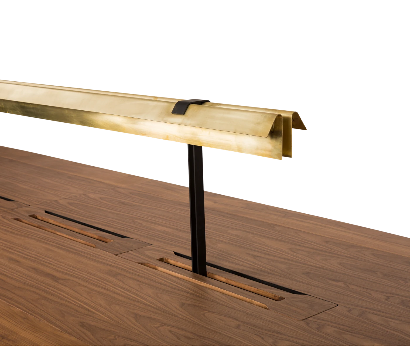 Detail view of the True Wing Library table with integrated brass reading lamp and dark timber tabletop.