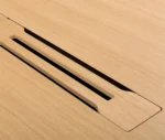 Close-up of the True Wing Meeting table magnetic wiring beam in light timber finish for cable management.