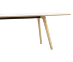 Half close-up of True Wing Working table with timber legs and white tabletop finish.