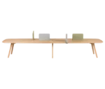 True Wing Working table in front view with light timber top and frame, with padded divider screens in different colors.